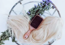 Wig Care: Washing, Storing and Extending Wig Life A wig with a brush for wig care and maintenance