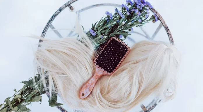 Wig Care: Washing, Storing and Extending Wig Life A wig with a brush for wig care and maintenance
