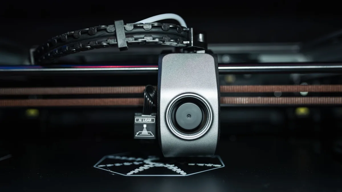 Close-up of a 3D printer extrusion head at work