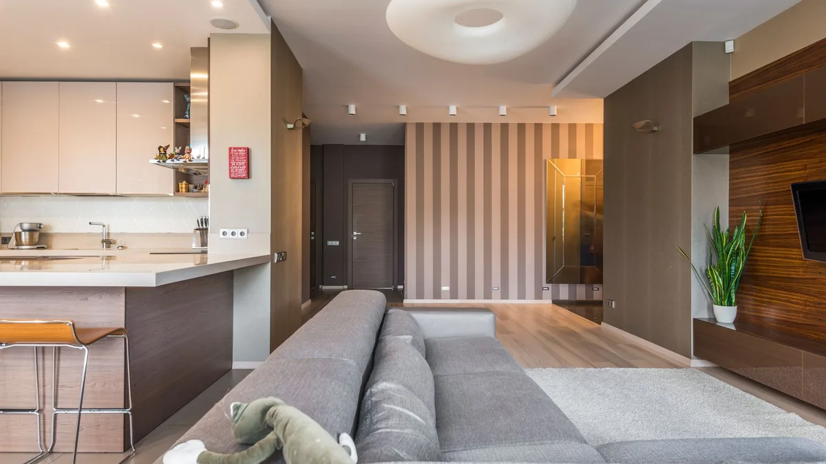 Bright modern living room with open plan kitchen