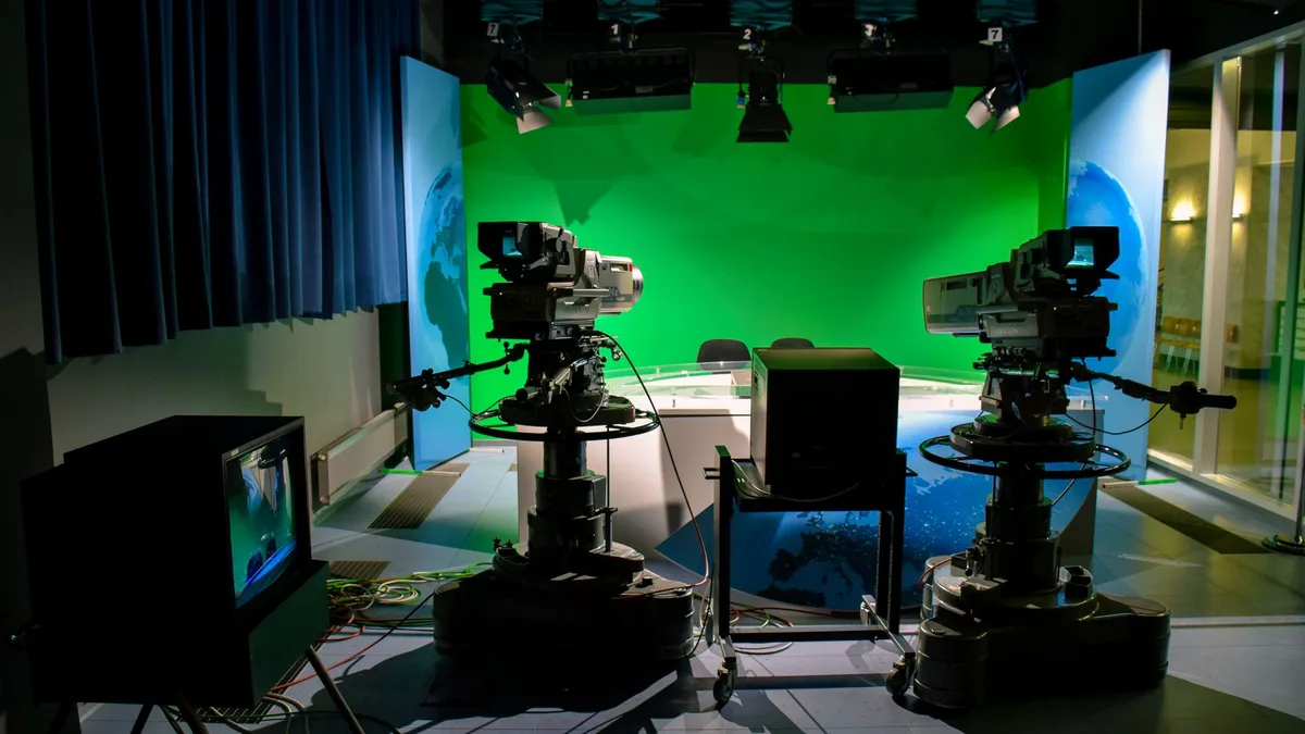 Television studio with cameras and lighting rig