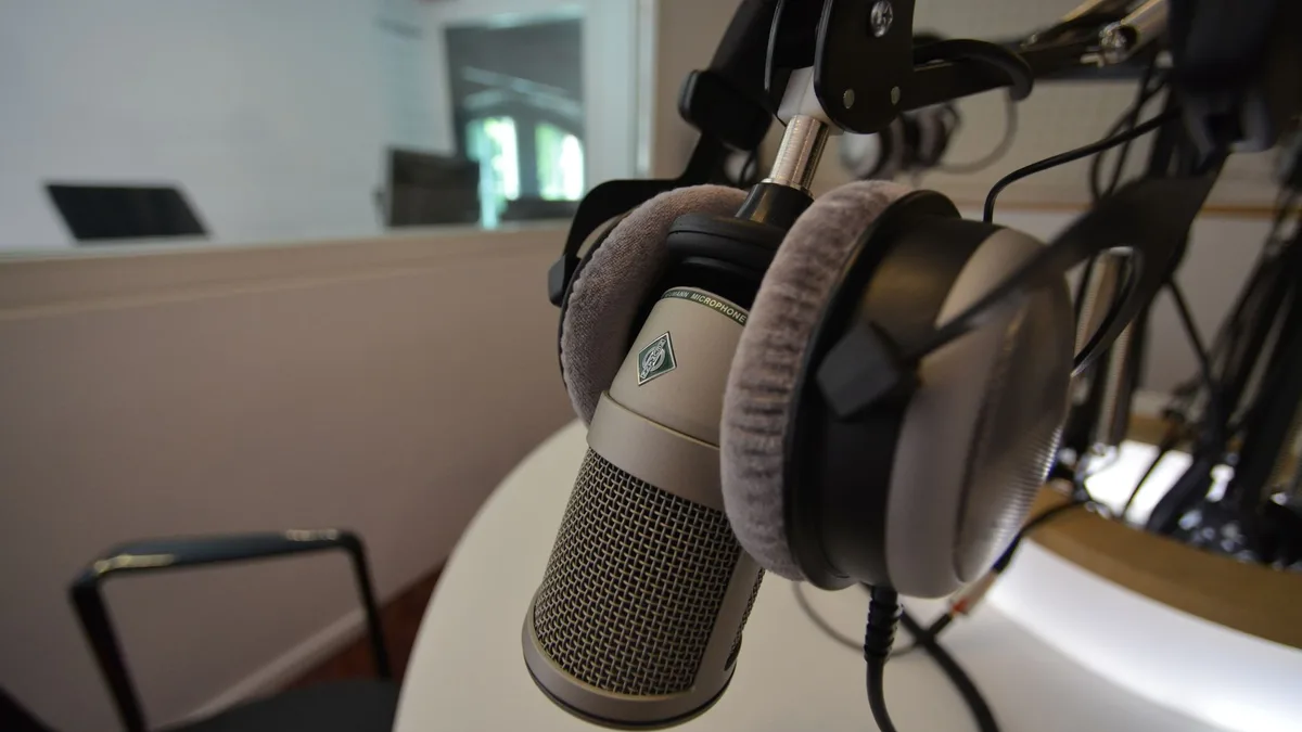 Close-up of a studio microphone with headphones