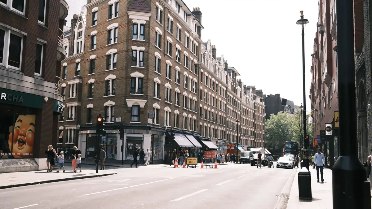 Busy central London street with shops and classic architecture