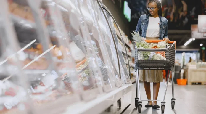 Best Grocery Stores in London 2026: Cheapest Supermarkets and Markets Woman selecting fresh groceries in a supermarket aisle
