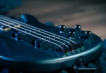 Bill Wyman Net Worth 2026: Why the Estimates Disagree Bill Wyman net worth - bass guitar strings and pickups on a dark stage