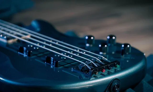 Bill Wyman Net Worth 2026: Why the Estimates Disagree Bill Wyman net worth - bass guitar strings and pickups on a dark stage