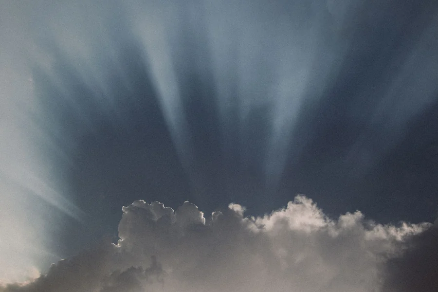 Blackest person in the world - sunbeams breaking through clouds