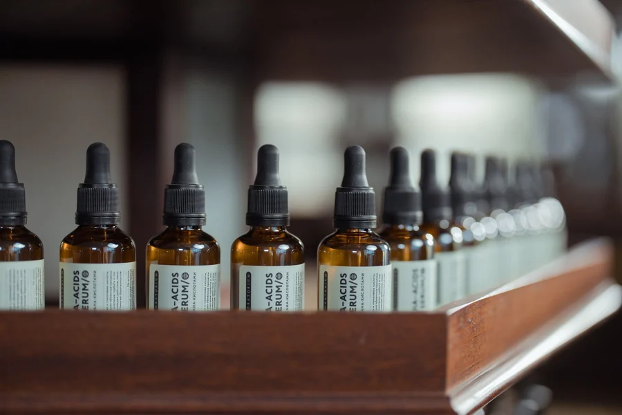 Blackest person in the world - row of skincare serum bottles on a shelf