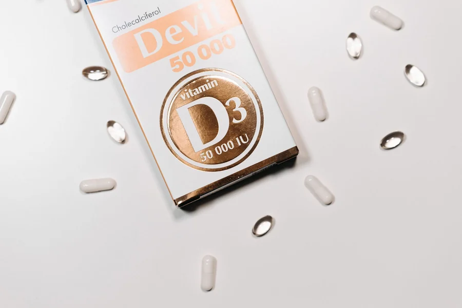 Blackest person in the world - vitamin D3 supplement box and capsules