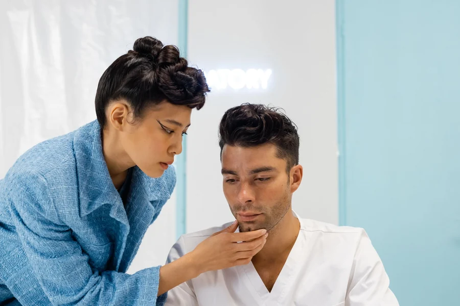 Blackest person in the world - medical professional examining a patient