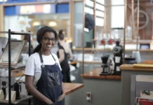 Business Line of Credit UK 2026: Real Rates, Fees and When to Avoid One Small business owner standing behind the counter of a cafe