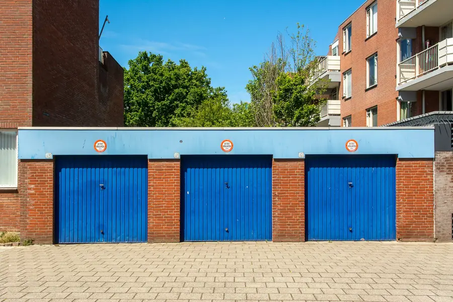 Darrell Sheets net worth - blue garage doors on a storage building