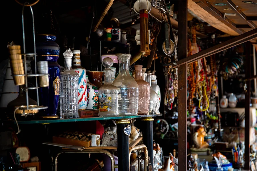 Darrell Sheets net worth - vintage glassware and collectibles on shelves