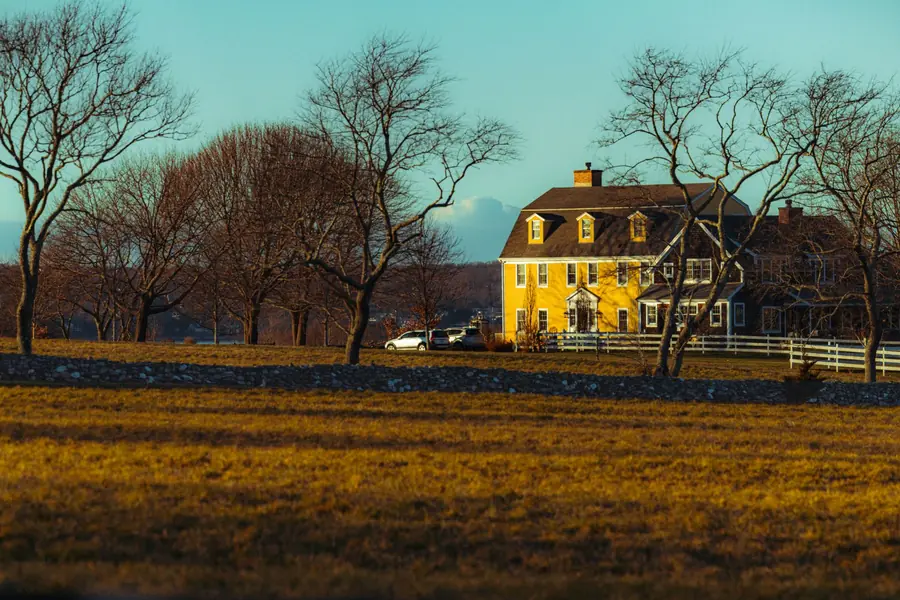 Dick Cavett net worth - yellow country house among autumn trees