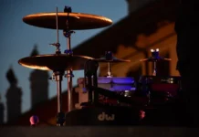 Don Henley Net Worth 2026: How the Eagles Money Works Don Henley net worth - drum kit set up on a concert stage at twilight
