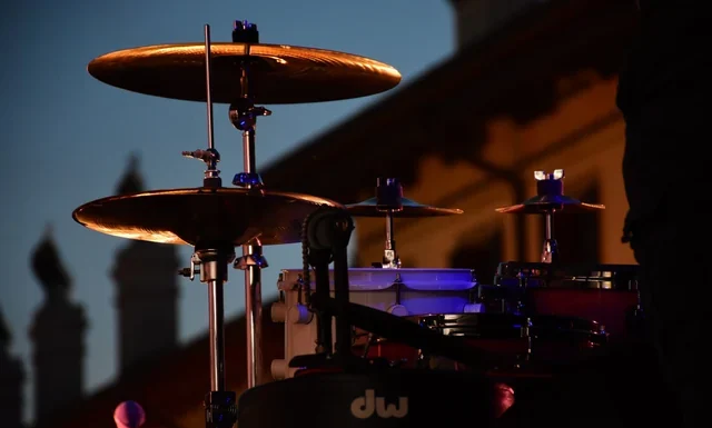 Don Henley Net Worth 2026: How the Eagles Money Works Don Henley net worth - drum kit set up on a concert stage at twilight