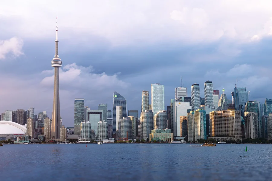 John Candy net worth - Toronto skyline with the CN Tower at sunset