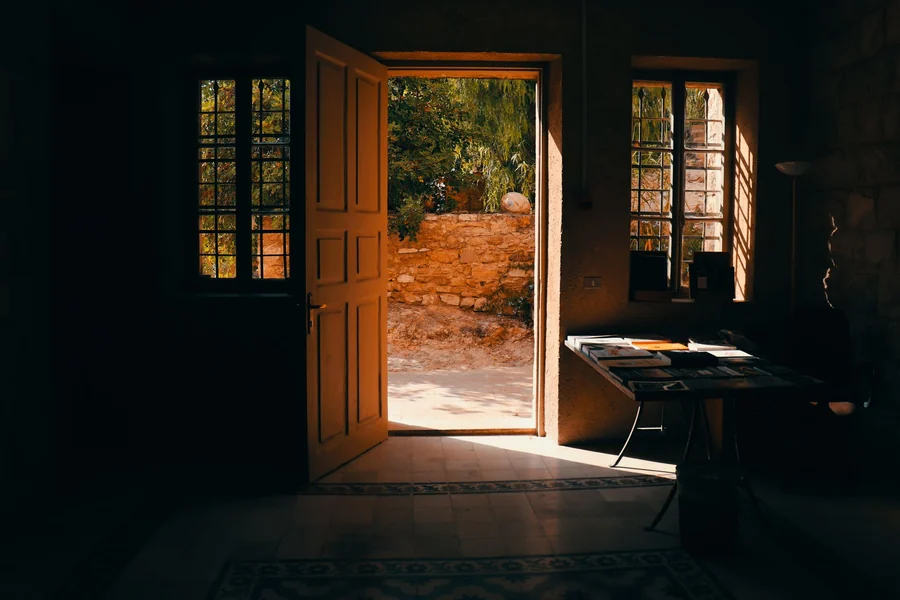 Kesha net worth - warm sunlight streaming through an open door