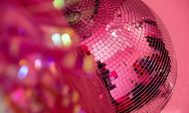 Kylie Minogue Net Worth 2026: Pop, Padam and 27m Bottles Kylie Minogue net worth - disco ball reflecting pink lights
