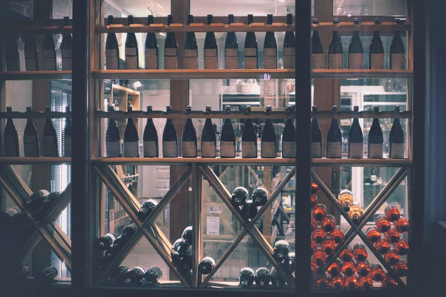 Kylie Minogue net worth - wine display with bottles in a shop