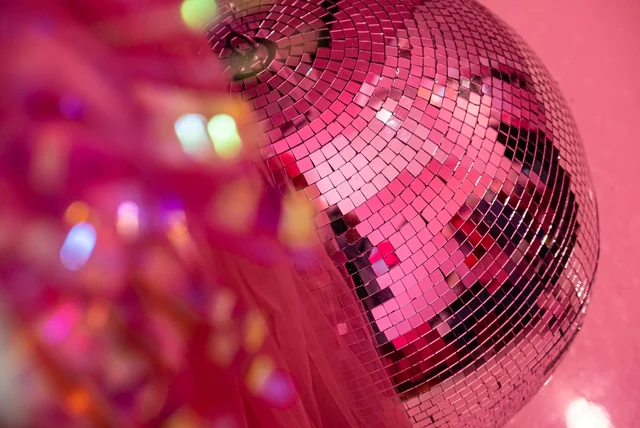 Kylie Minogue Net Worth 2026 Kylie Minogue net worth - disco ball reflecting pink lights