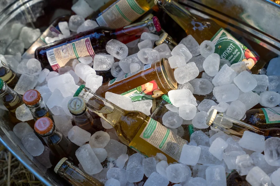 Land Shark beer UK - bottles chilling on ice in a metal tub outdoors