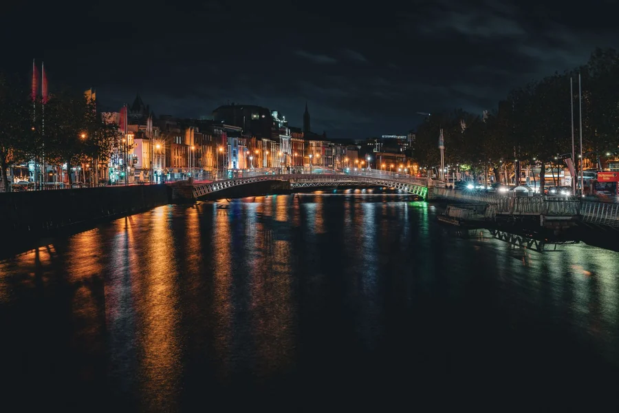 Louis Walsh net worth - Dublin's Ha'penny Bridge lit up at night