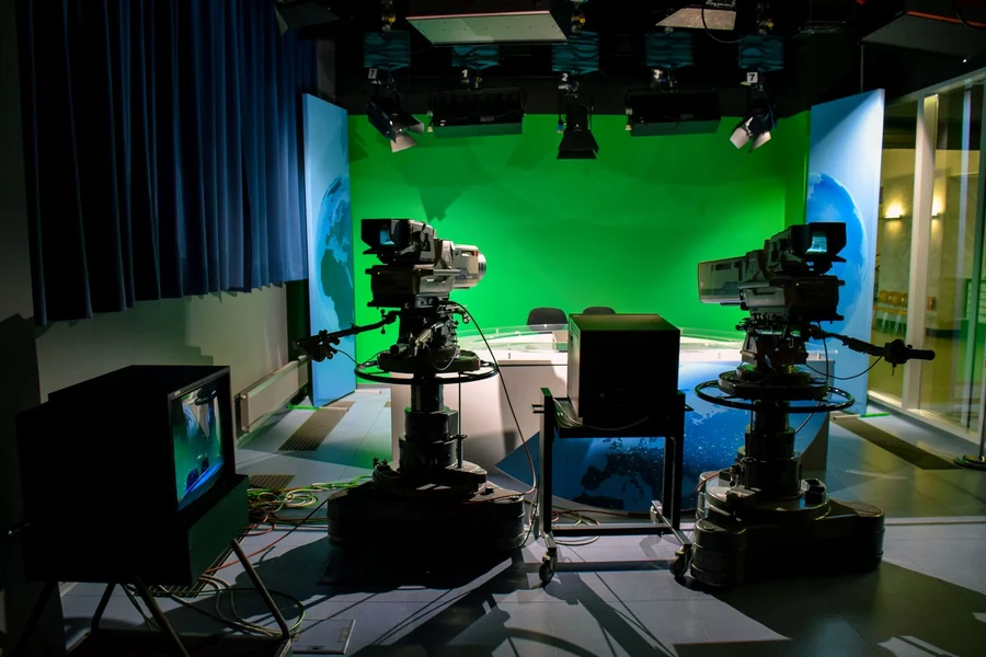 Marie Osmond net worth - television studio set with broadcast cameras