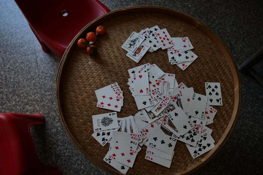 Memory matching game - playing cards scattered across a table
