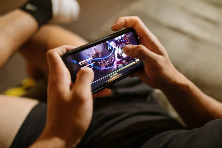 Memory matching game - person playing a game on a smartphone