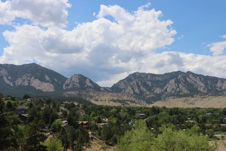 Pam Dawber net worth - the Flatirons in Boulder, Colorado, under blue sky