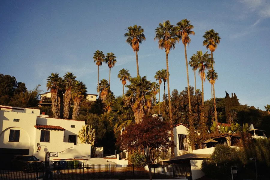 Pam Dawber net worth - Spanish-style houses with palm trees in southern California