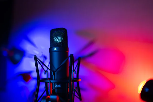 Snoop Dogg Net Worth 2026 Snoop Dogg net worth - microphone under colourful neon stage lighting