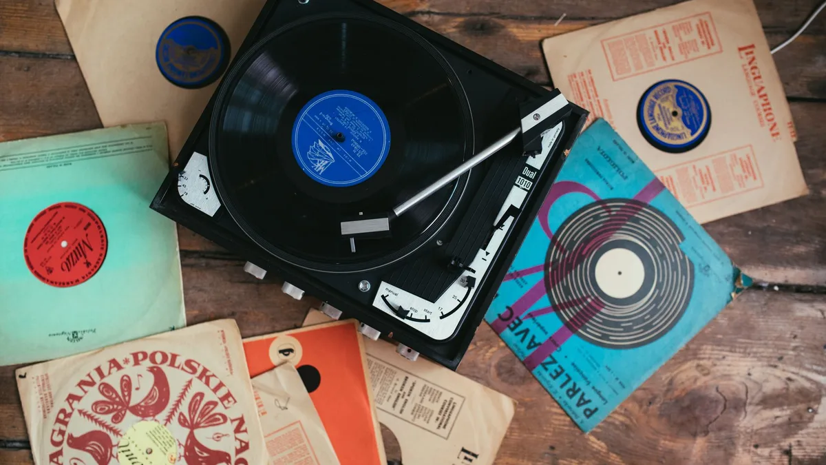 Vintage vinyl records around a classic turntable