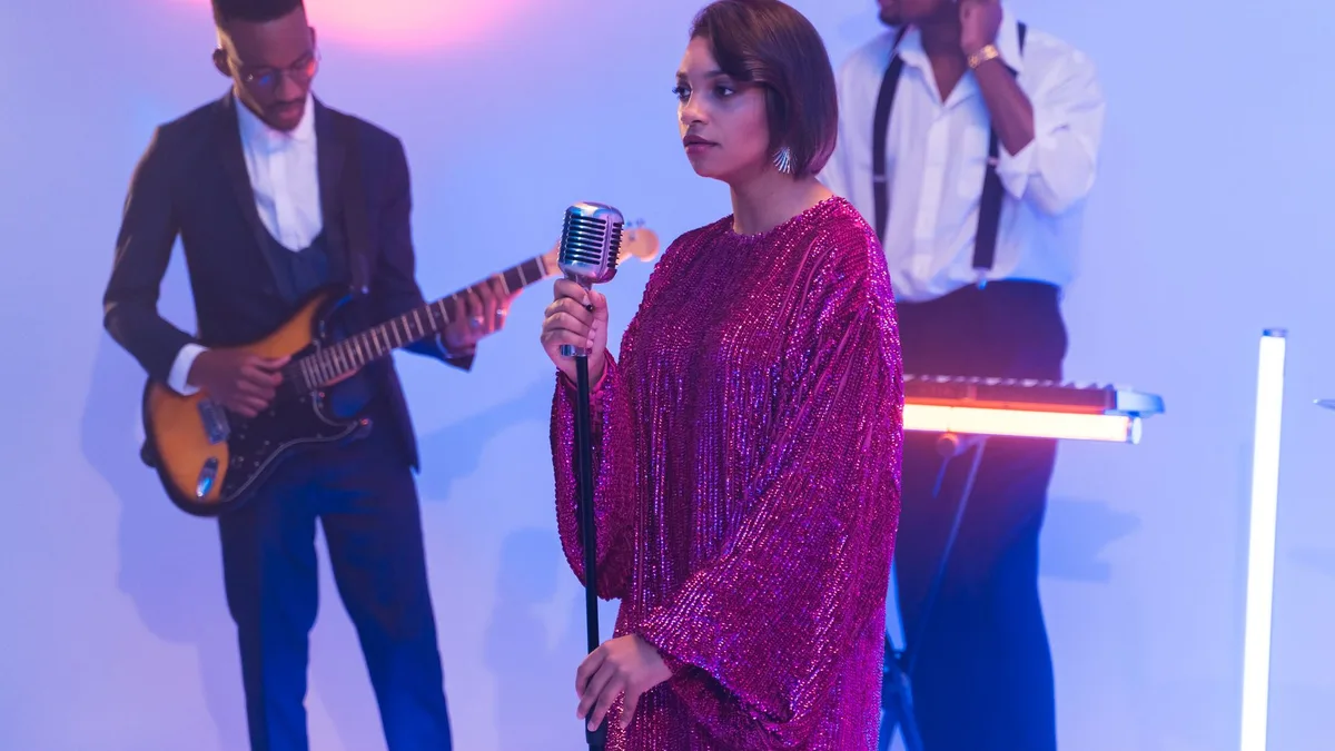 Band performing together in a retro setting