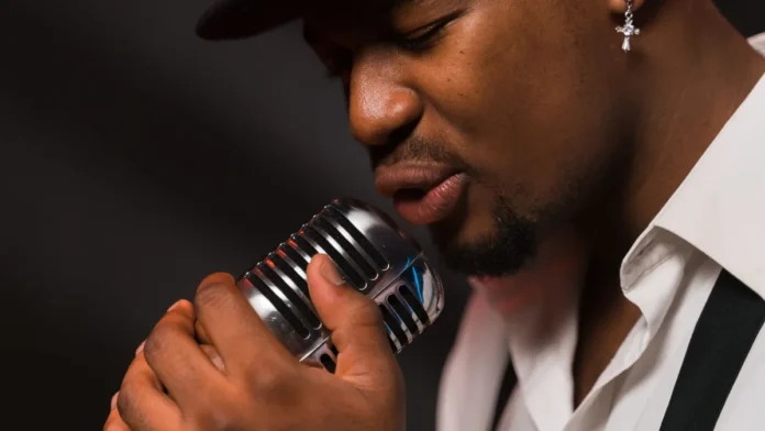 Singer performing into a vintage microphone on stage