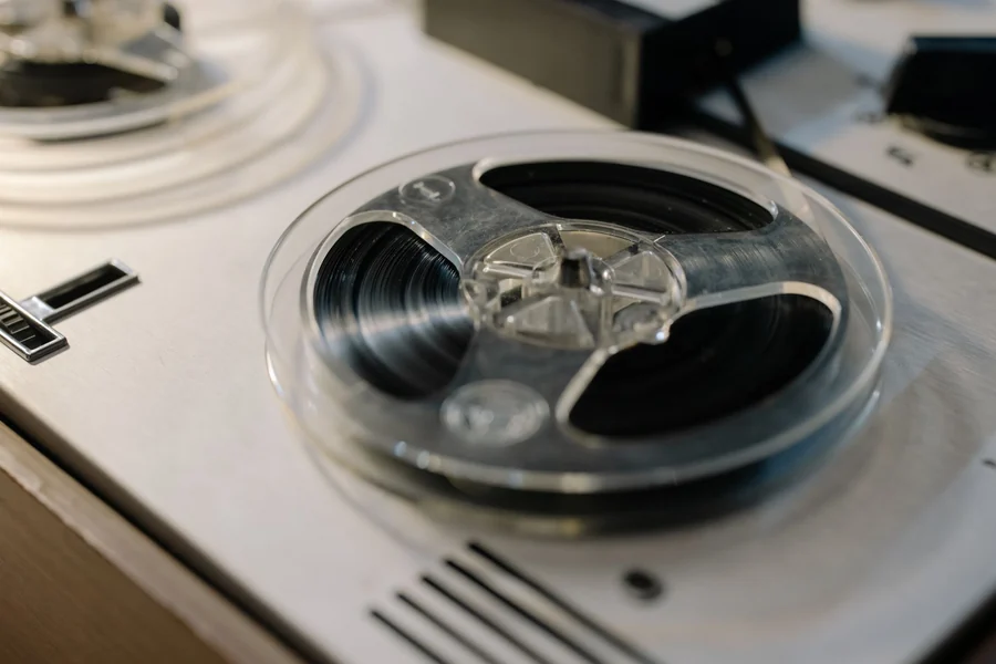Taylor Swift net worth - analogue reel-to-reel tape recorder in a studio