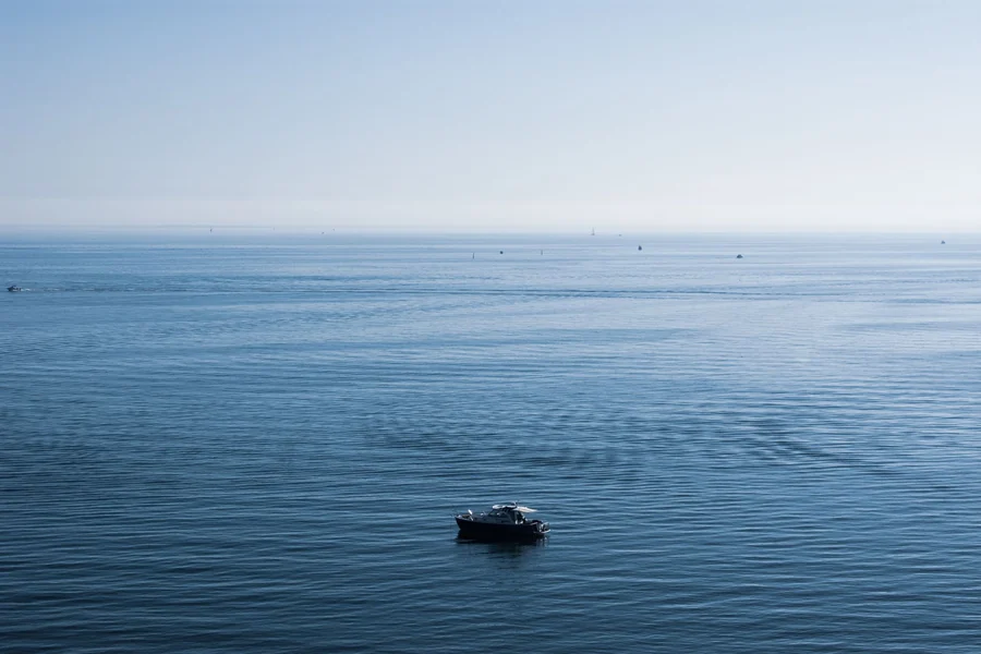 Tina Louise net worth - small boat on a calm blue sea