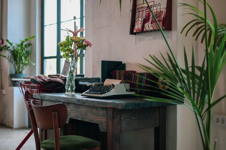 Tina Louise net worth - vintage typewriter on a wooden desk