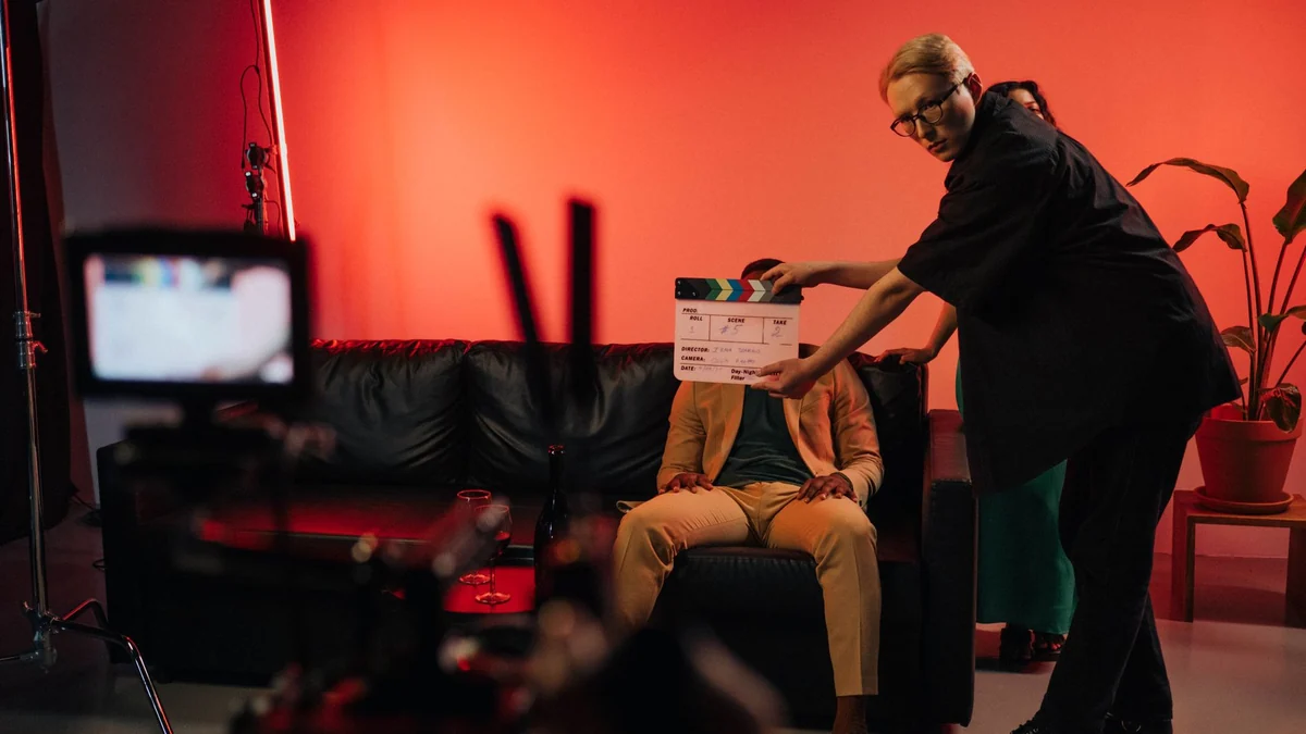 A film production team setting up a scene on an indoor set